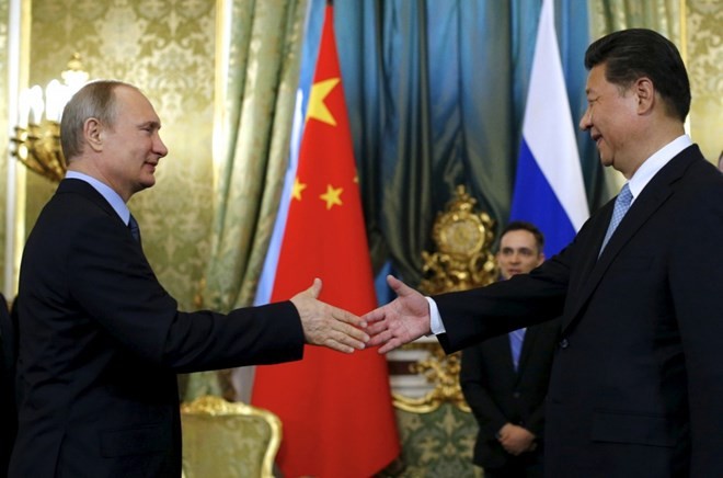 Reuters: Moi quan he Nga - Trung chi la ao anh